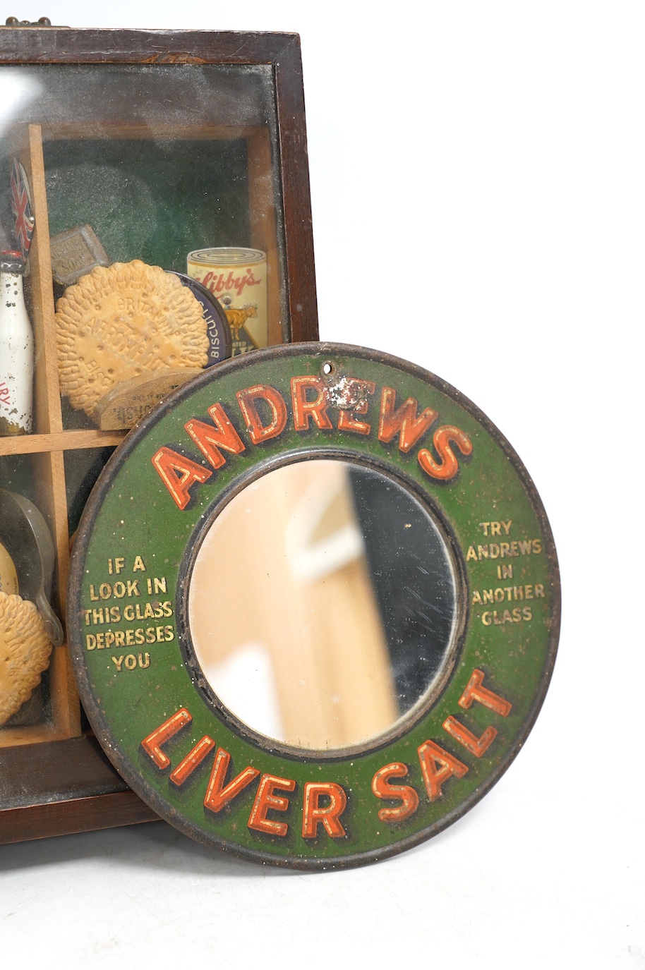 An early 20th century Andrews Liver Salt circular advertising mirror, 20cm diameter, together with a collection of novelty pocket mirrors, milk caps, etc. Condition - fair to good